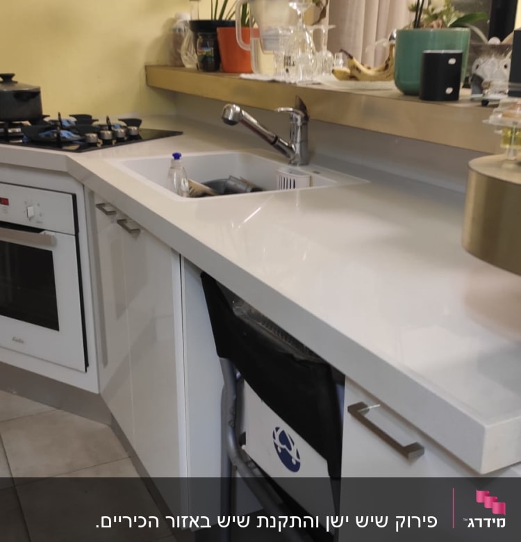 kitchen counter with marble surface and sink